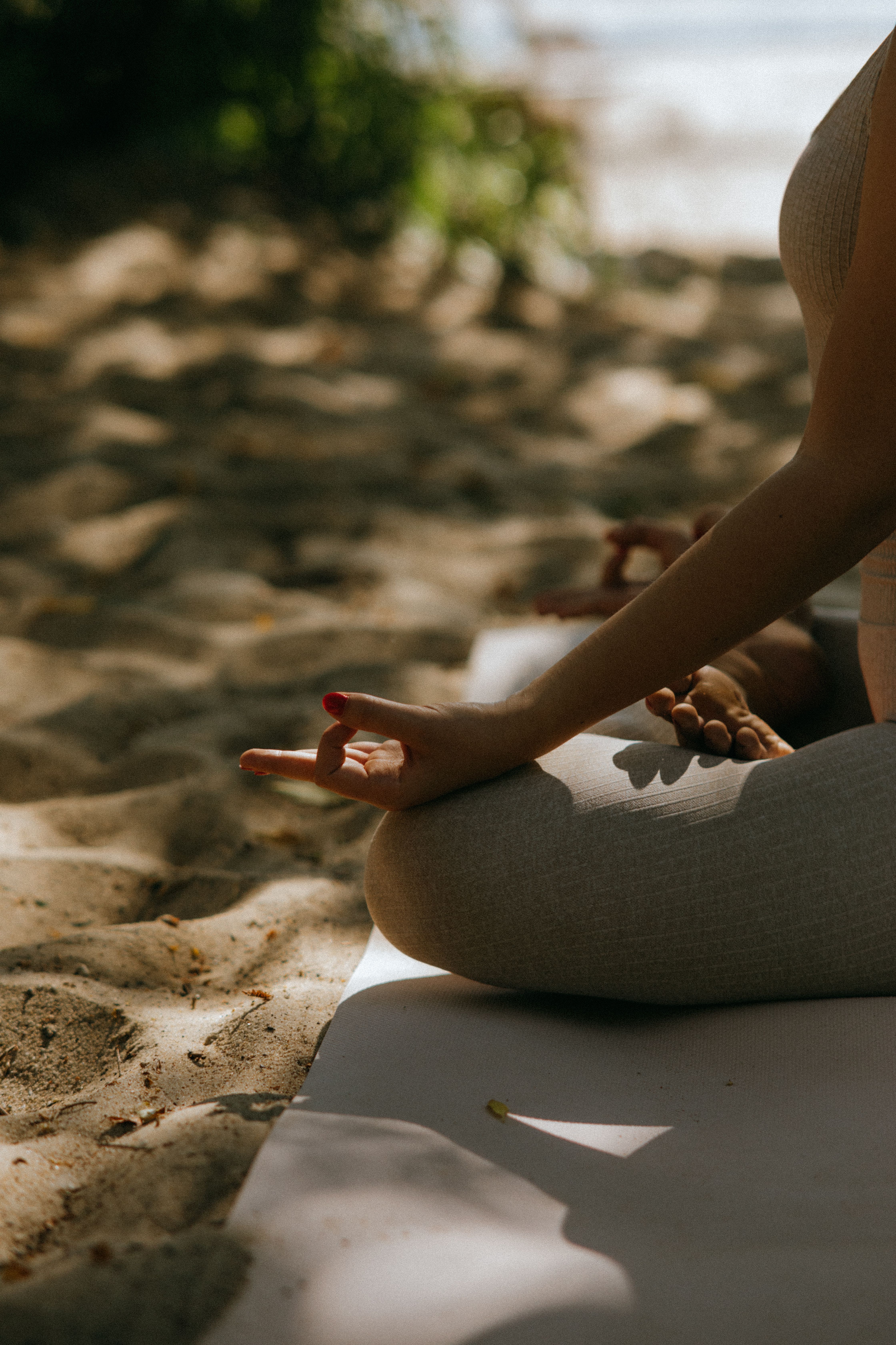 A person practising a quiet moment of wellbeing outdoors